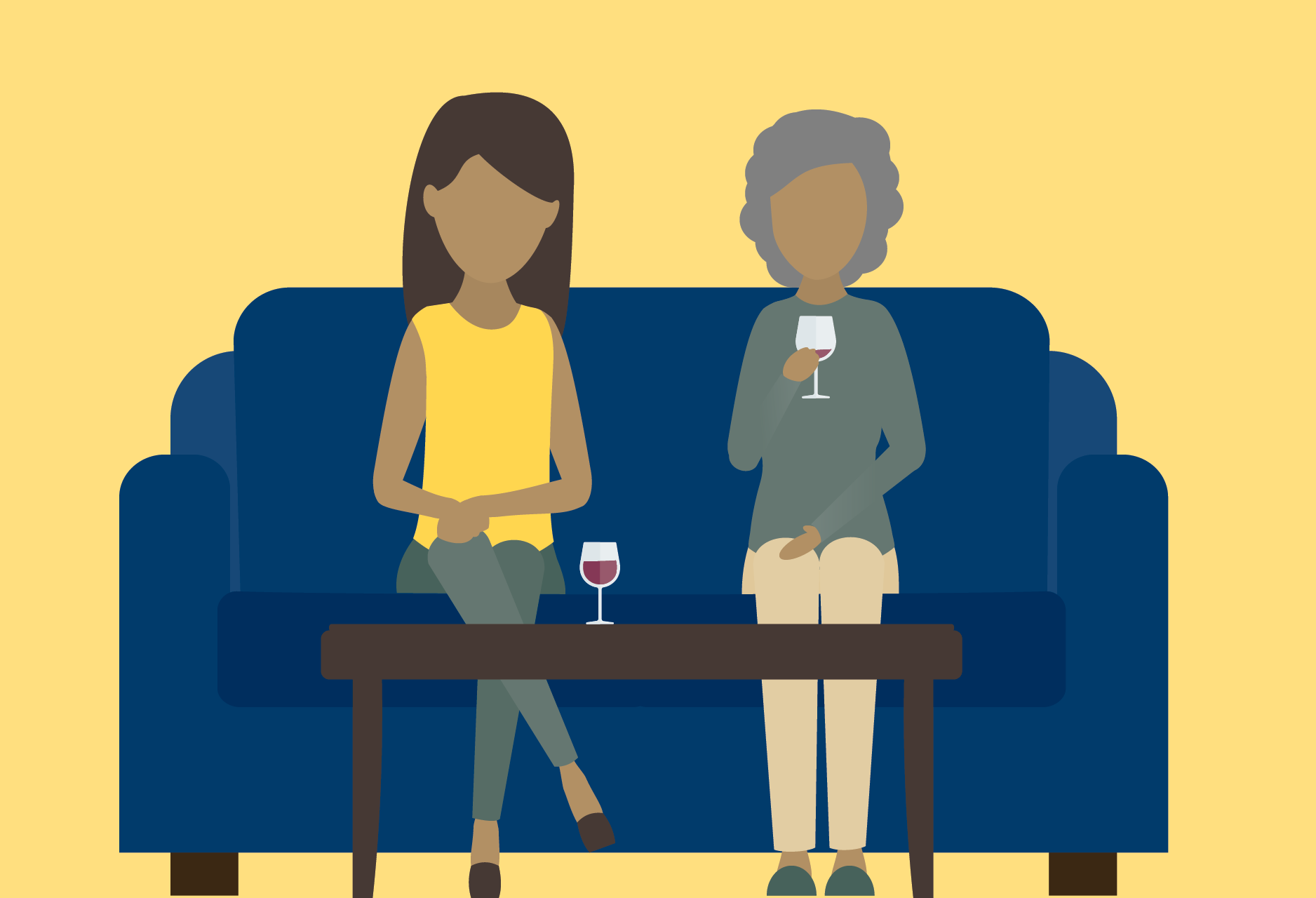Two women sitting on a couch drinking wine