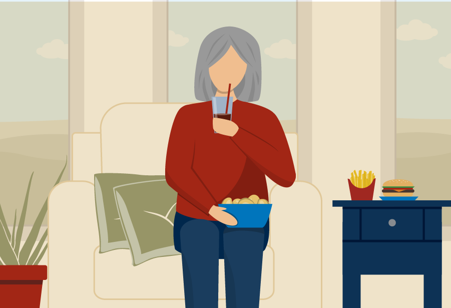 older woman sitting on couch eating highly processed food