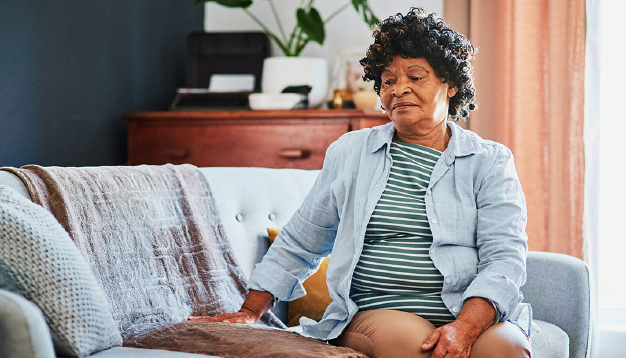 Older woman sitting on couch