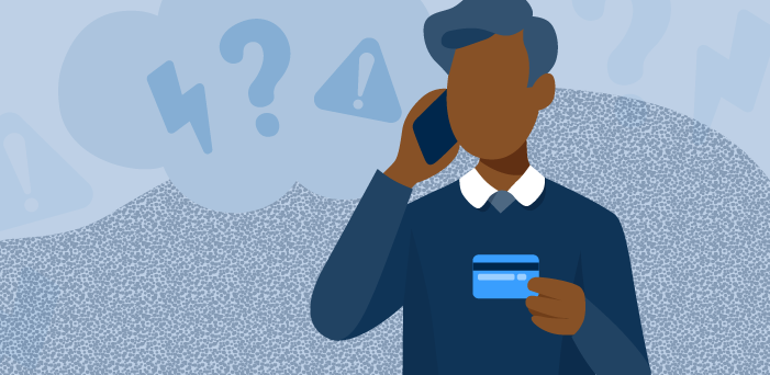 An older man on phone holding credit card
