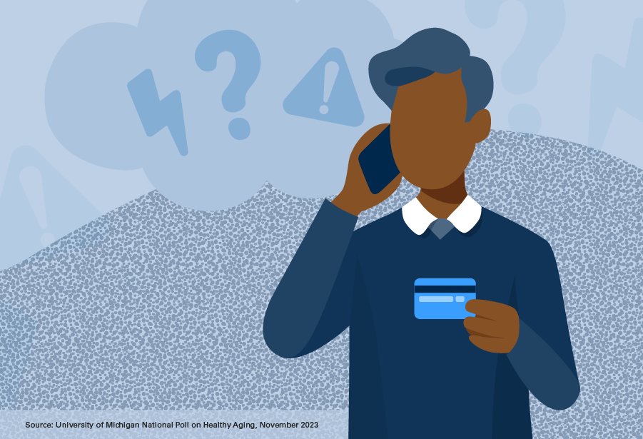 A man talking on phone holding credit card