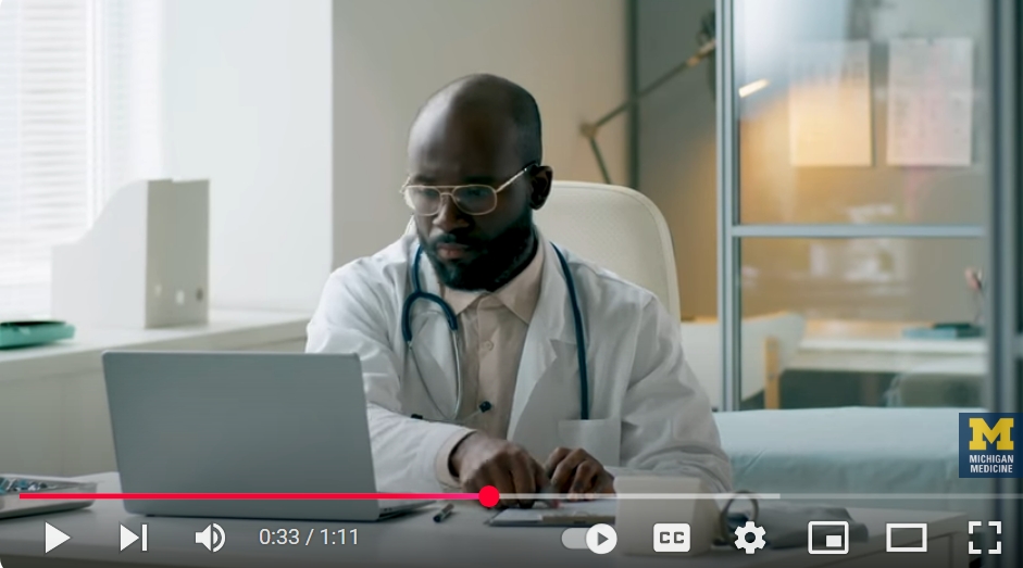 doctor typing on computer