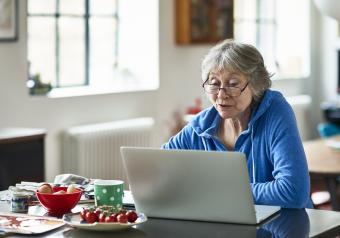 Older woman looking at doctor reviews online