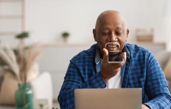 Older man talking to phone